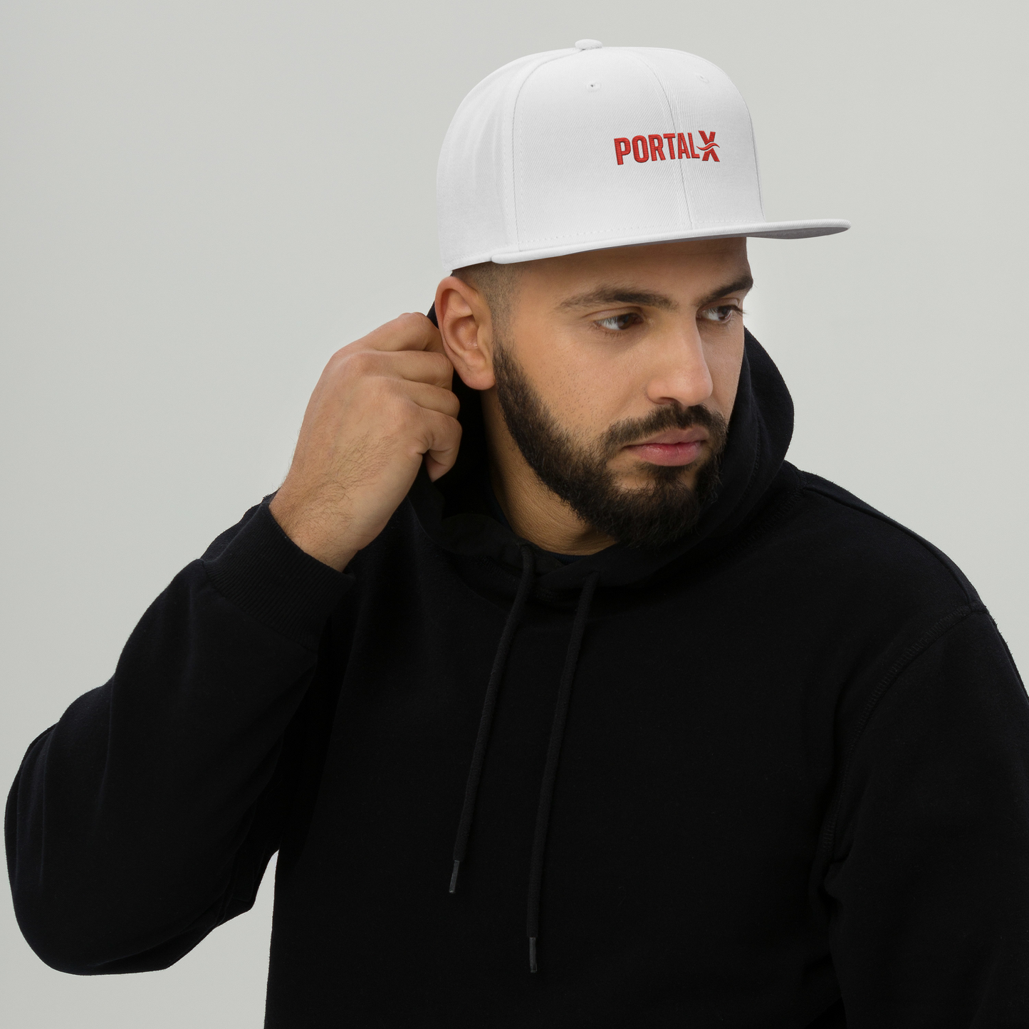 PORTAL X embroidered snapback cap — white, lifestyle front